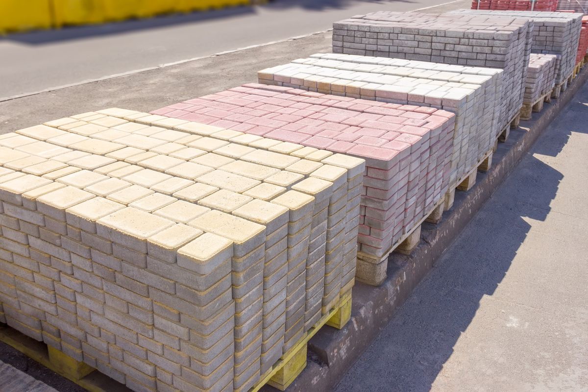 Varicolored concrete decorative pavement tiles on an outdoor warehouse