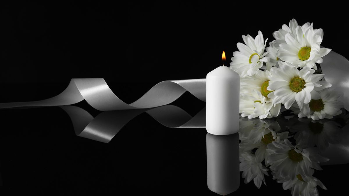 Burning,Candle,,White,Chrysanthemum,Flowers,And,Ribbon,On,Black,Mirror