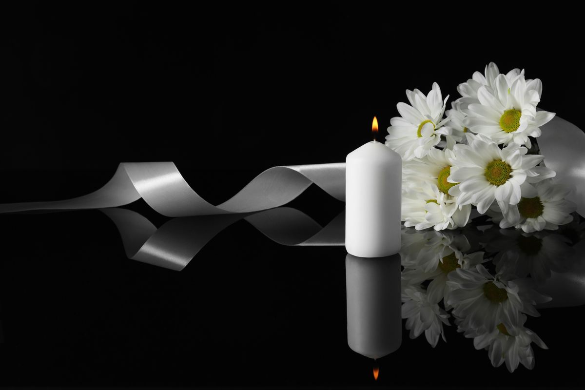 Burning,Candle,,White,Chrysanthemum,Flowers,And,Ribbon,On,Black,Mirror