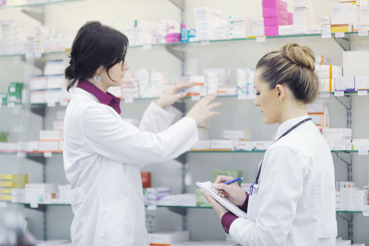 Team,Of,Pharmacist,Chemist,Woman,Group,Standing,In,Pharmacy,Drugstore