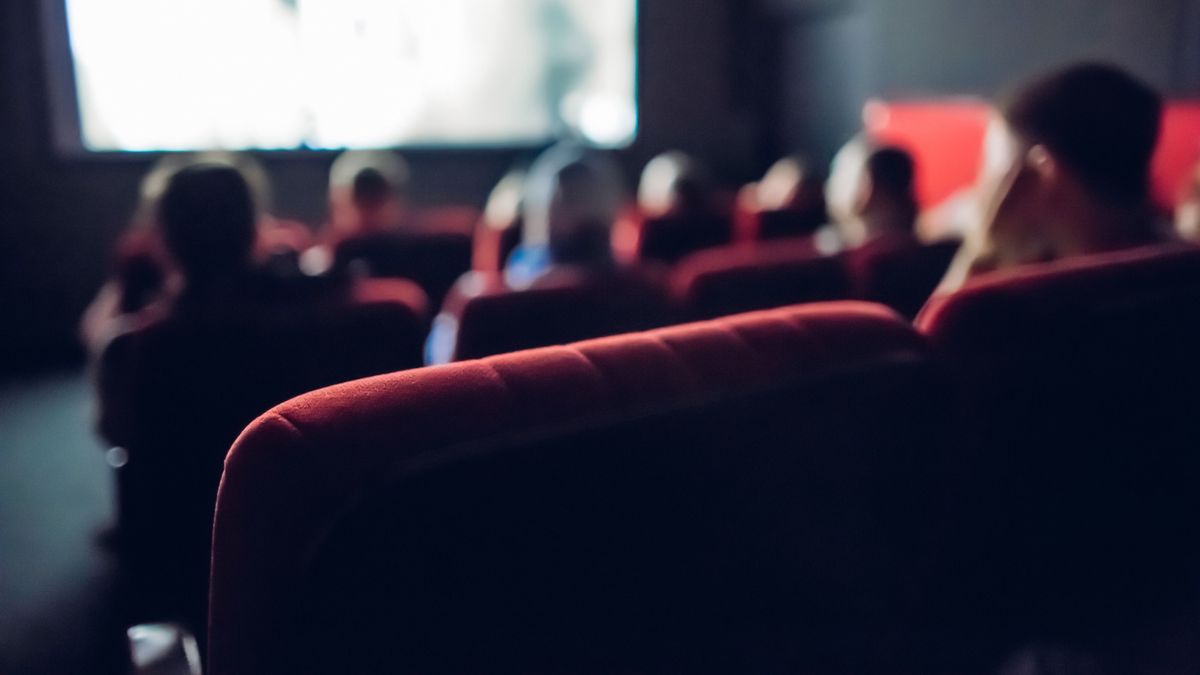 Small,Movie,Theater,Background.,Audience,In,The,Dark